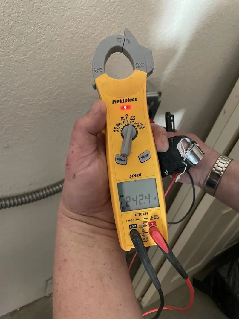 Voltage testing with clamp meter during Ceiling Fan Installation in Edwardsville